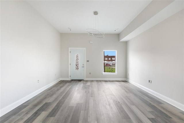 spare room with hardwood / wood-style flooring