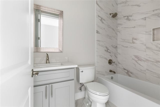 full bathroom with vanity, toilet, and tiled shower / bath