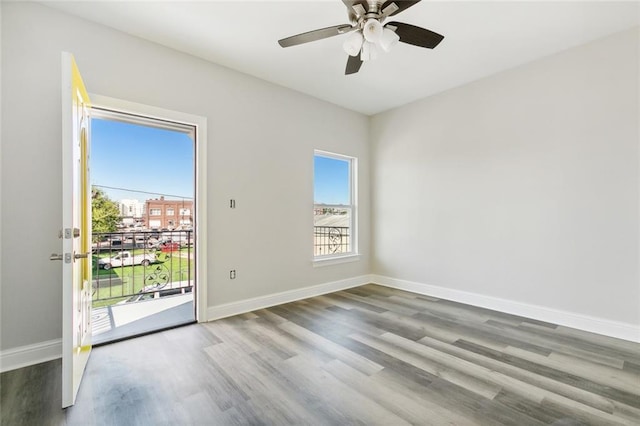 spare room with wood-type flooring and ceiling fan