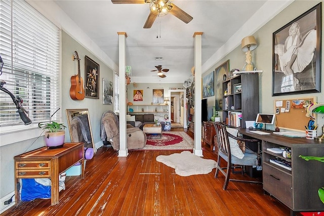 home office with ceiling fan and dark hardwood / wood-style flooring