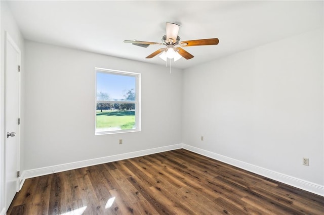 unfurnished room featuring dark hardwood / wood-style floors and ceiling fan