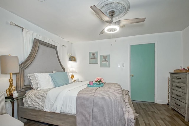 bedroom featuring hardwood / wood-style floors and ceiling fan