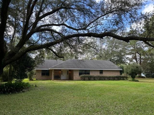 view of front of home with a front lawn