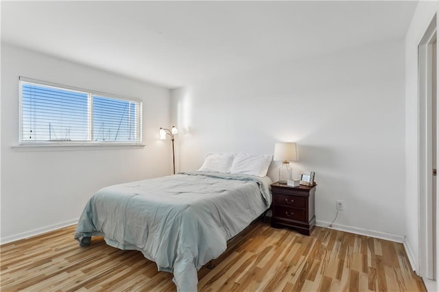 bedroom with light hardwood / wood-style floors