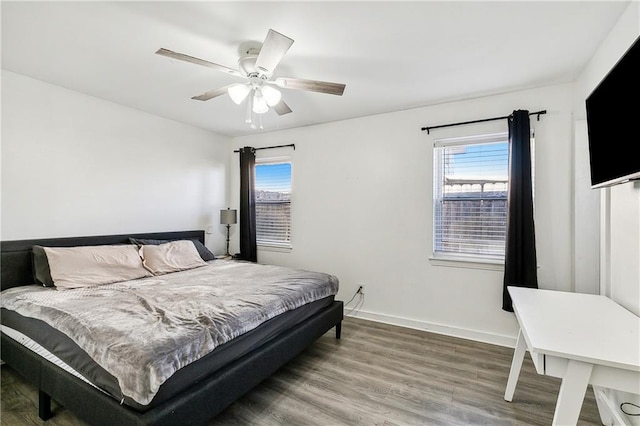 bedroom featuring ceiling fan and hardwood / wood-style floors