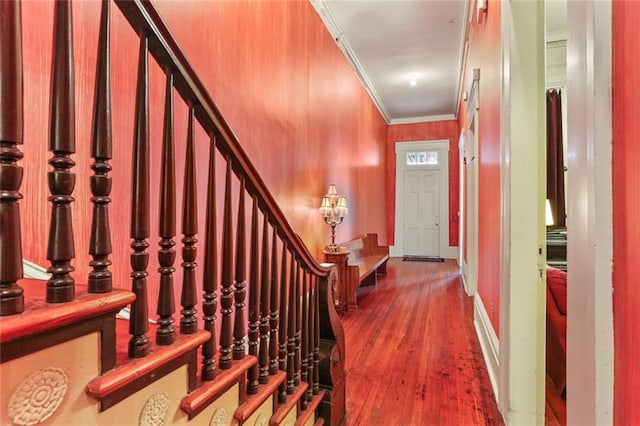 foyer entrance featuring hardwood / wood-style flooring and ornamental molding