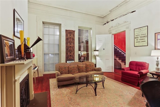 living room featuring crown molding and hardwood / wood-style flooring