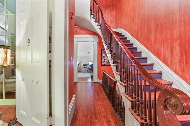 stairs with hardwood / wood-style floors