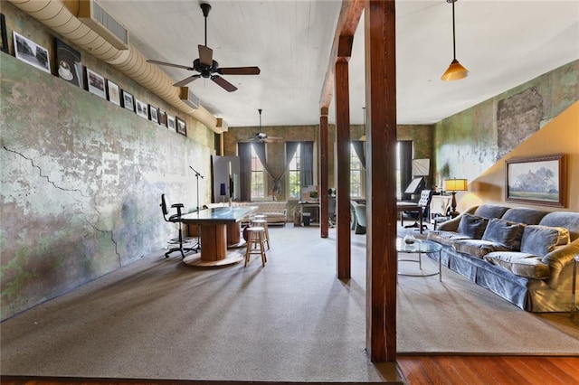 living room featuring hardwood / wood-style floors and ceiling fan