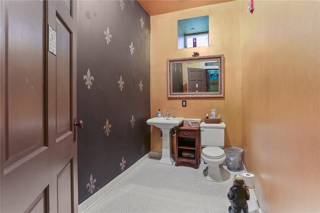 bathroom with tile patterned flooring and toilet