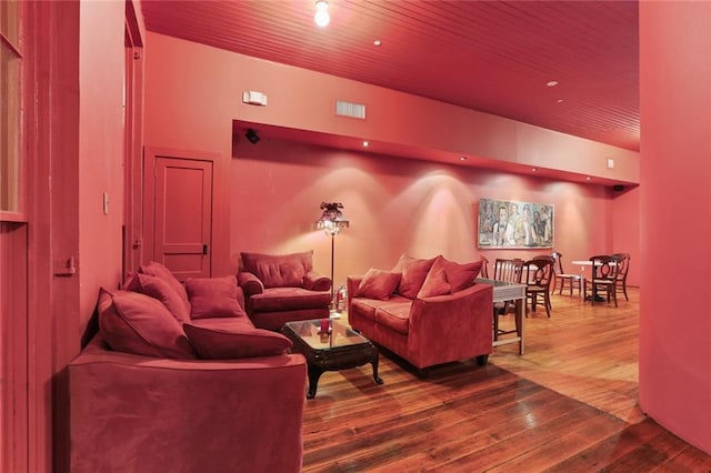 living room featuring hardwood / wood-style floors and wood ceiling