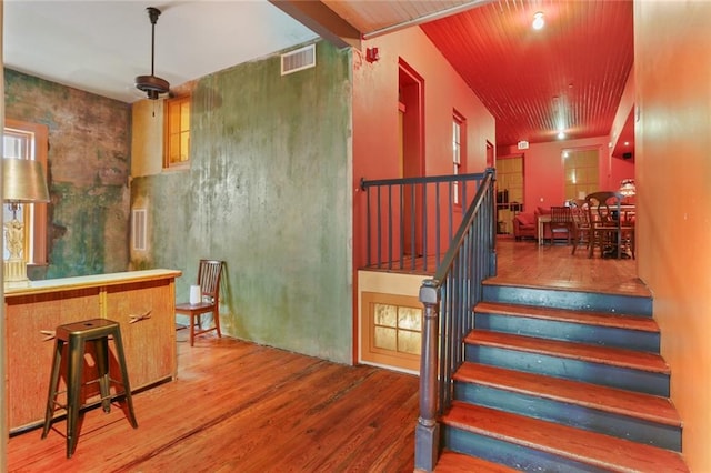 staircase with wood-type flooring