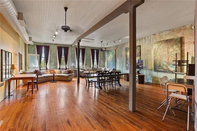 dining space with hardwood / wood-style floors, ceiling fan, and rail lighting