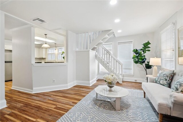 312 Papworth Ave, Metairie, LA 70005 - living room with baseboards, stairs, wood finished floors, and recessed lighting