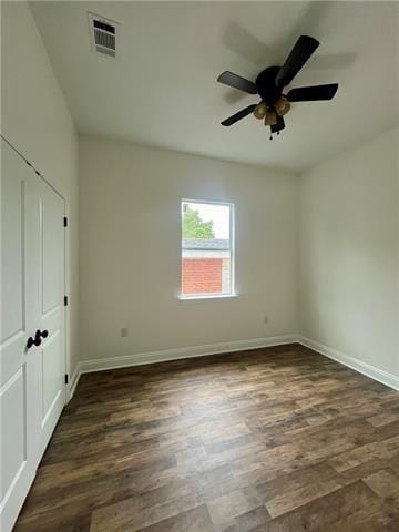 interior space featuring ceiling fan and dark wood-type flooring