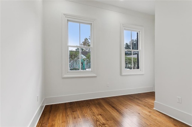 unfurnished room featuring wood-type flooring