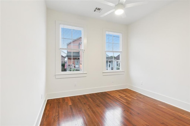 empty room with hardwood / wood-style flooring and ceiling fan