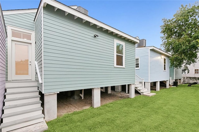 view of side of property with a lawn