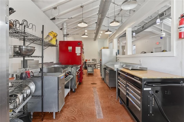 kitchen featuring hardwood / wood-style flooring, ceiling fan, stainless steel fridge, and beamed ceiling