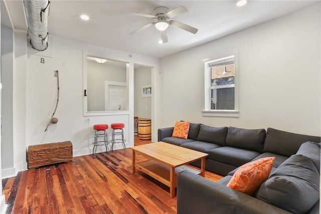 living room with ceiling fan and hardwood / wood-style floors