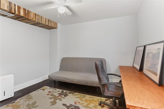 office space with ceiling fan and dark hardwood / wood-style floors