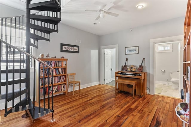 interior space with hardwood / wood-style flooring and ceiling fan