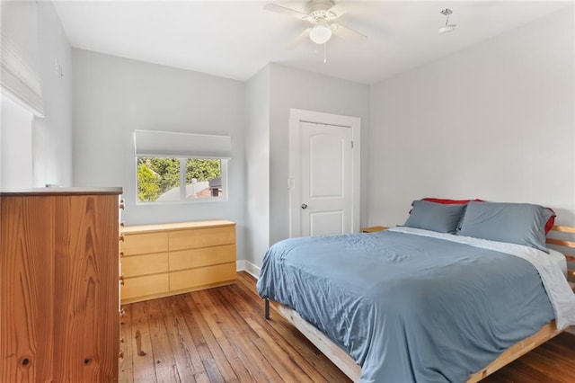 bedroom featuring hardwood / wood-style floors and ceiling fan