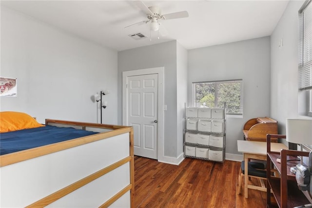 bedroom featuring ceiling fan and dark hardwood / wood-style flooring