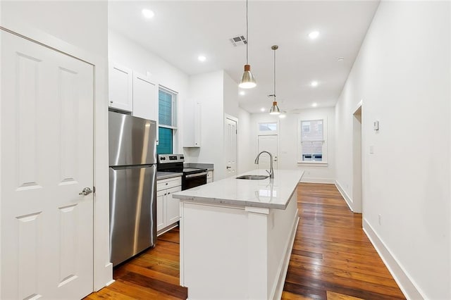 kitchen featuring white cabinetry, sink, an island with sink, and stainless steel appliances