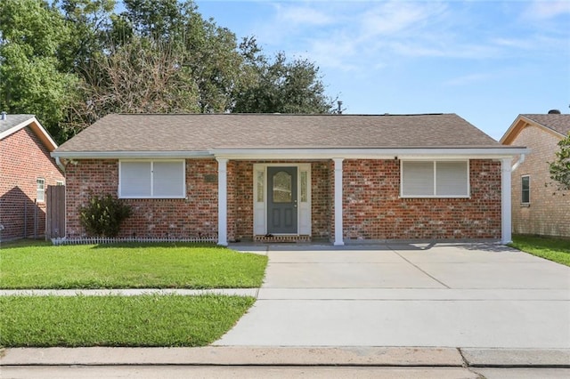 single story home with a front yard and covered porch