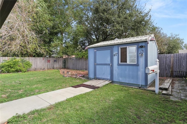 view of outbuilding with a yard