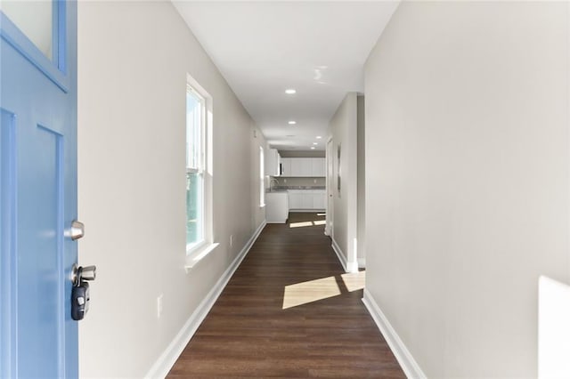 corridor featuring dark hardwood / wood-style floors