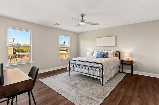 bedroom featuring dark hardwood / wood-style floors and ceiling fan