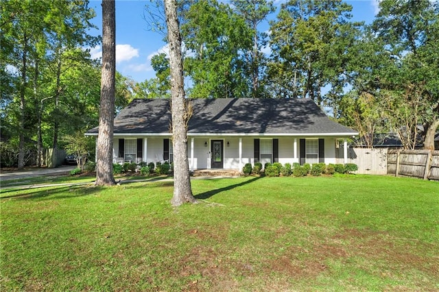 single story home with covered porch and a front yard