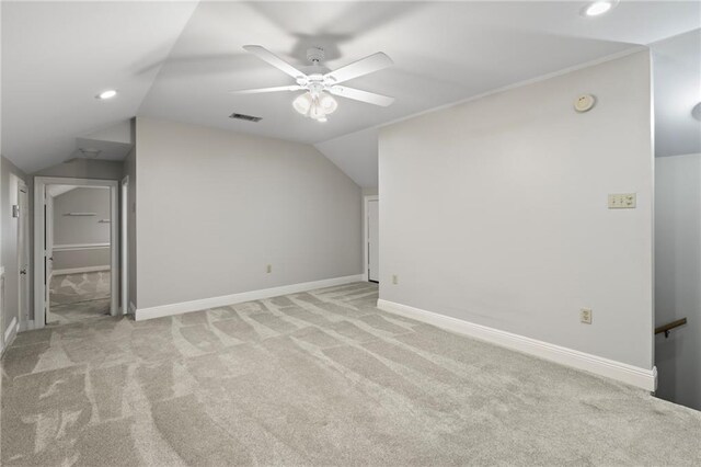 bonus room with ceiling fan, light colored carpet, and lofted ceiling