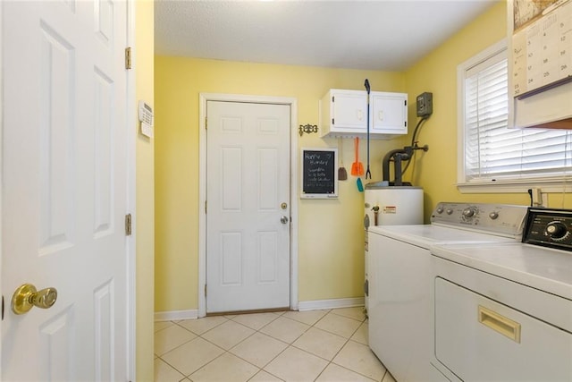 washroom with water heater, light tile patterned flooring, and independent washer and dryer