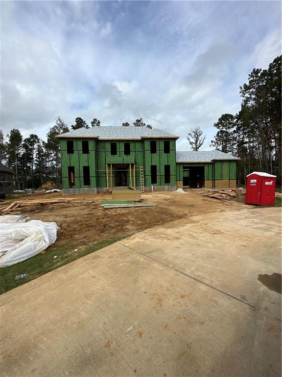 view of front of house with an outbuilding