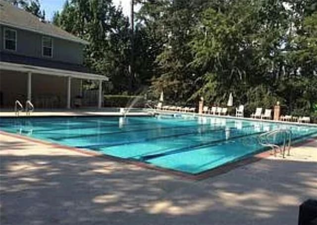 pool with a patio area