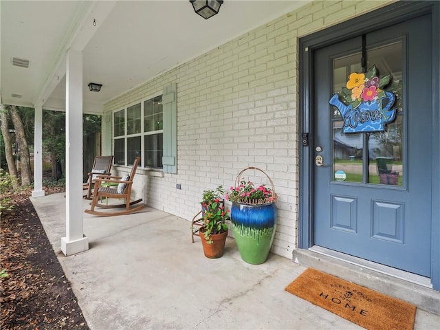 property entrance with covered porch