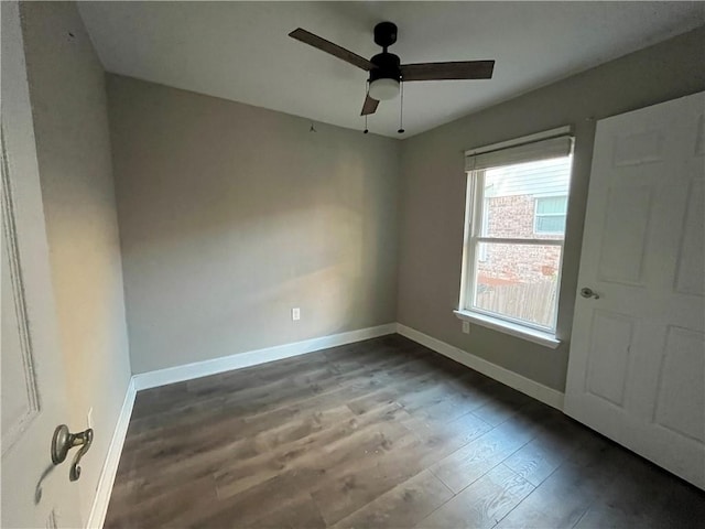 spare room featuring hardwood / wood-style flooring and ceiling fan