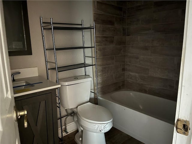 full bathroom featuring vanity, toilet, and tiled shower / bath combo