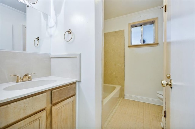 bathroom featuring vanity, toilet, and crown molding