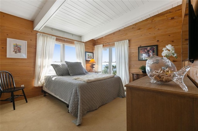 carpeted bedroom featuring vaulted ceiling with beams, wood walls, and wood ceiling