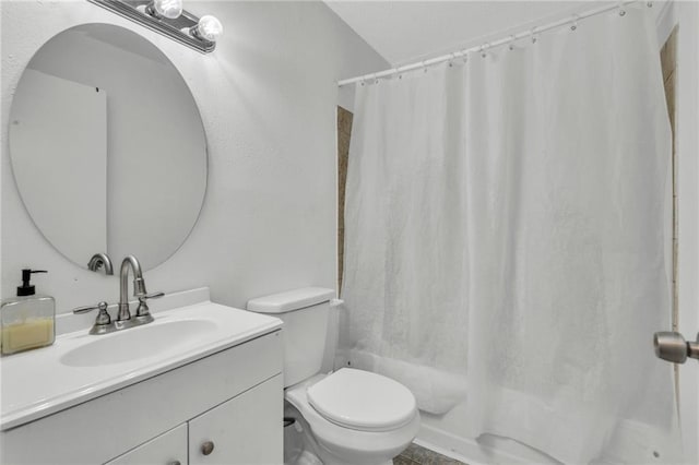 full bathroom with vanity, shower / bath combination with curtain, and toilet