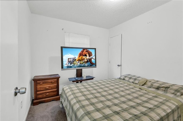 carpeted bedroom with a textured ceiling