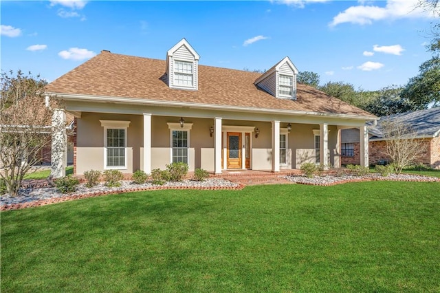 view of front of property featuring covered porch and a front lawn