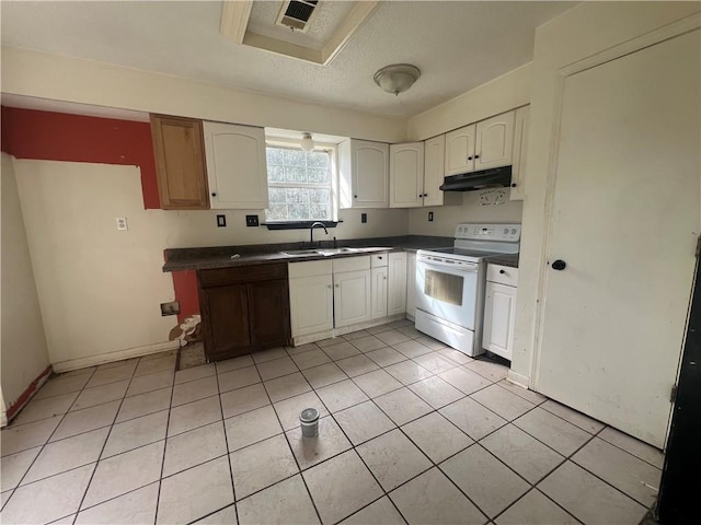 kitchen with electric stove, sink, white cabinets, and light tile patterned floors