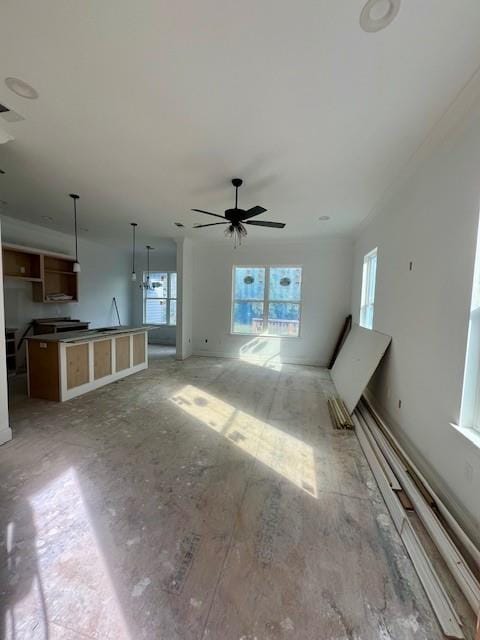 unfurnished living room with ceiling fan