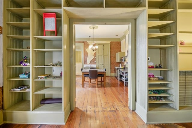 interior space with hardwood / wood-style floors and a notable chandelier