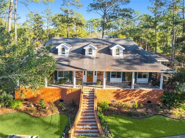 new england style home with a front yard